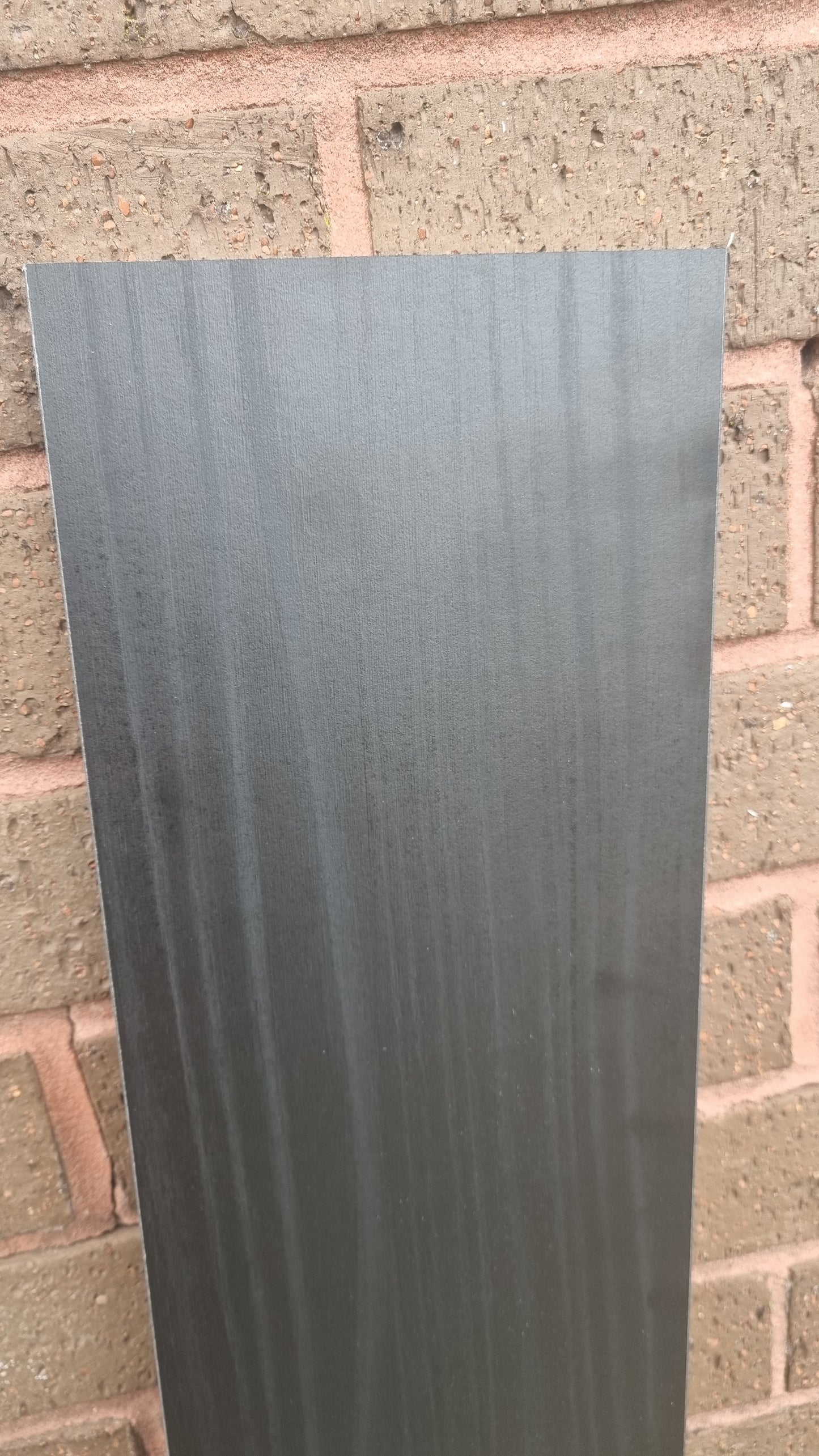 Black grained wood effect melamine (New Black Ash). Furniture or shelving board can be cut to size. Various sizes available