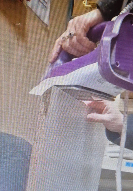 Iron on edging a melamine board at home demonstration video. Edge your own shelving board